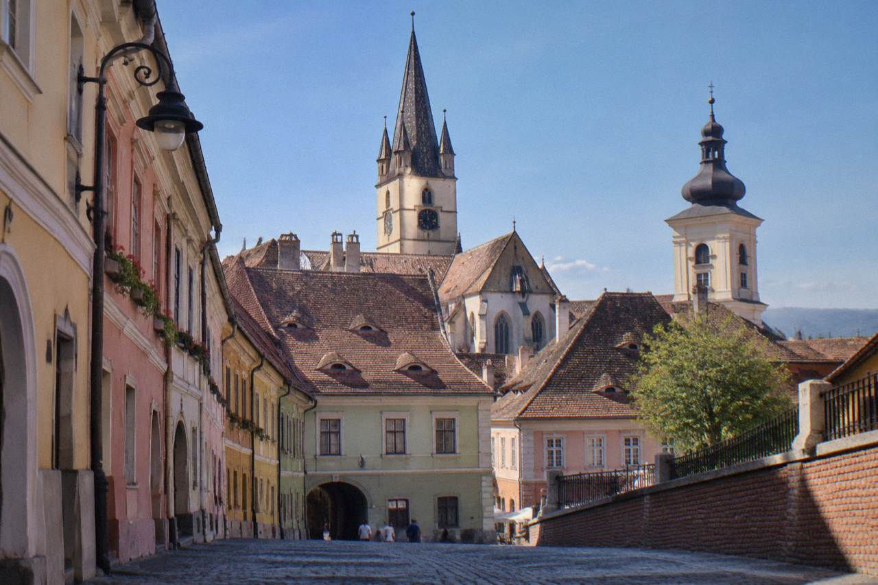 Colourful old houses and church towers above the rooftops of Sibiu's historic centre