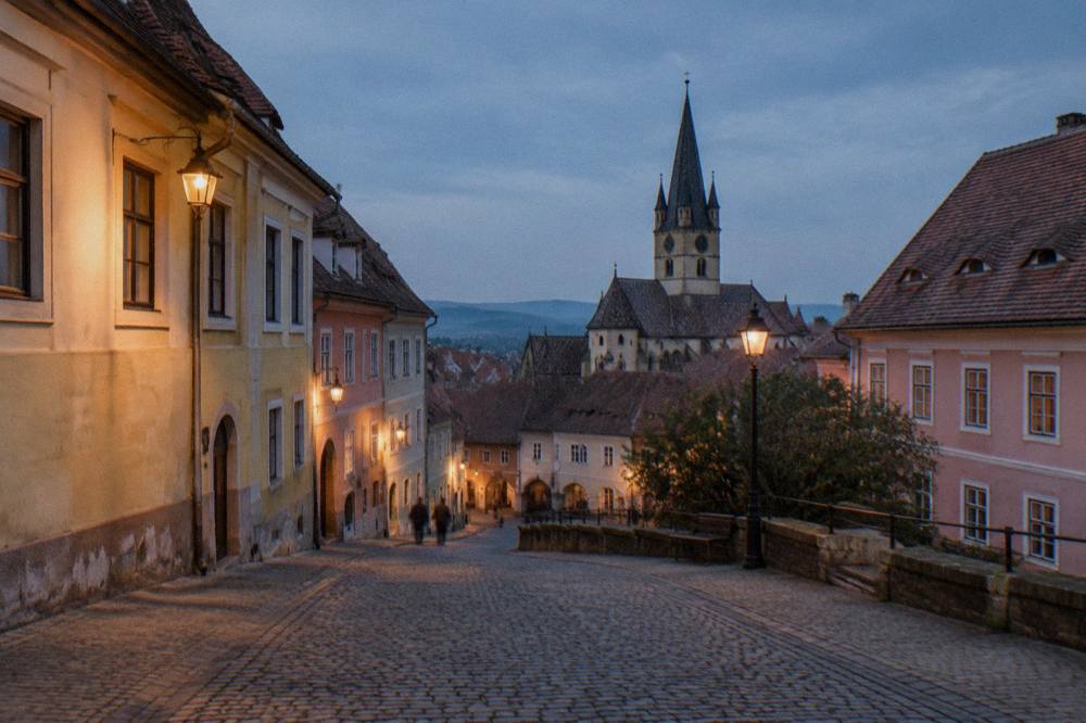 Evening light on a quiet cobbled street in the Lower Town of Sibiu