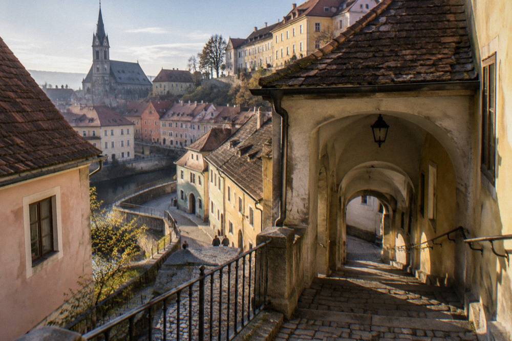 A covered stone staircase passage climbing between old buildings toward Sibiu's Upper Town