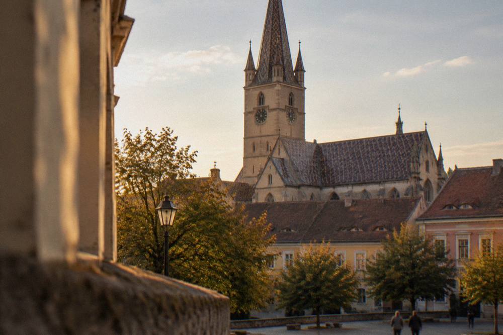 The tower and roofline of Sibiu's Evangelical Cathedral seen across the Upper Town