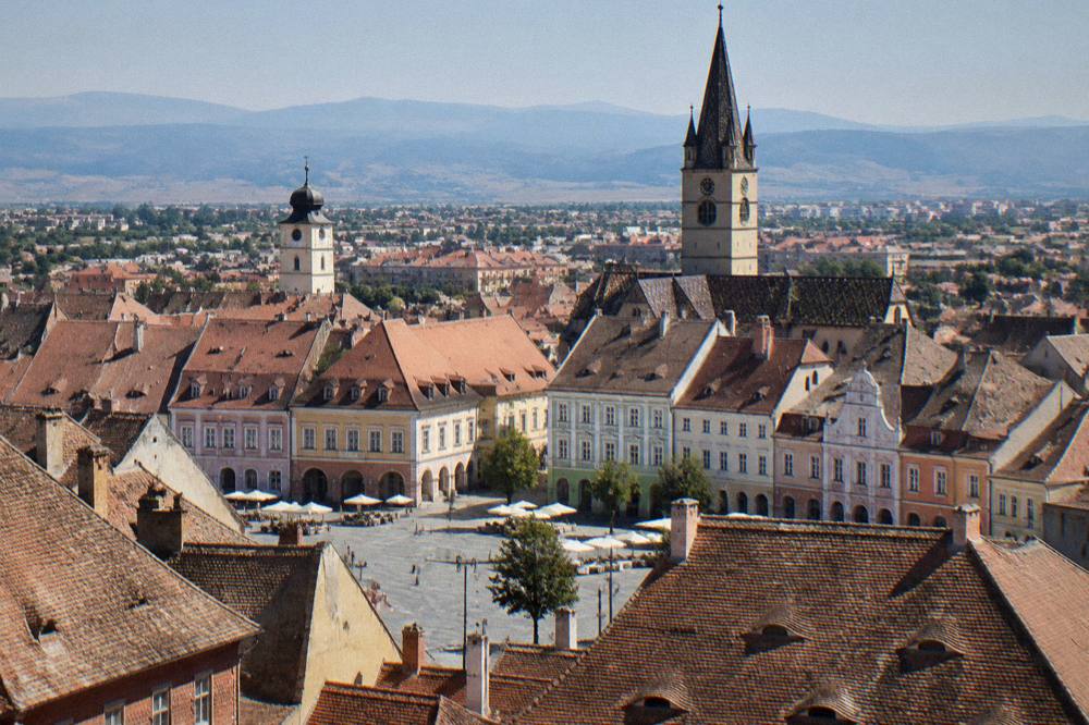 Panorama of Sibiu's old town rooftops seen from a high vantage point above the squares