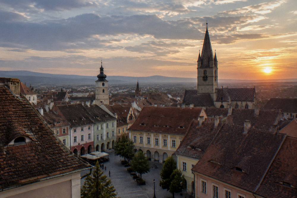 An evening view over the rooftops and church towers of Sibiu old town