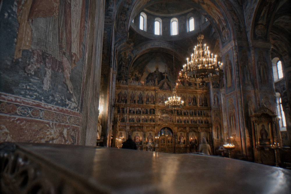 Painted interior of the Orthodox Cathedral with icons, chandeliers and the iconostasis