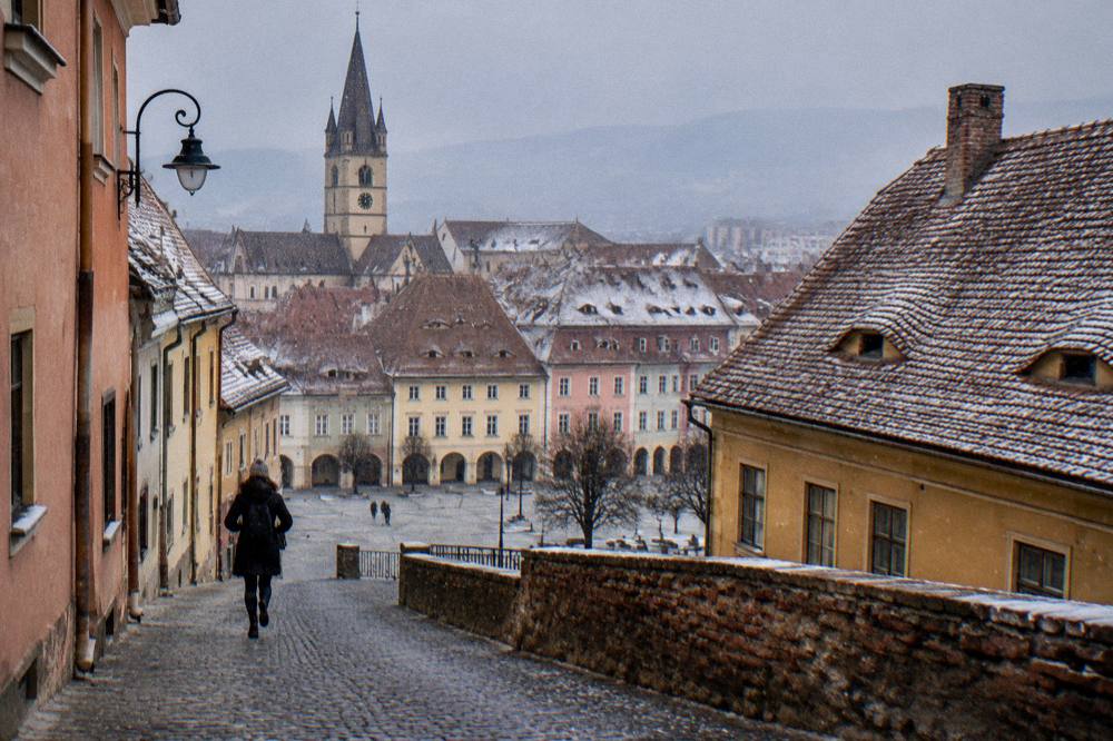 Colourful old town squares and rooftops of Sibiu seen from above
