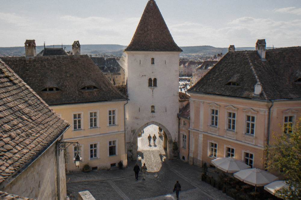 The arched base of the Council Tower with the passage leading toward the Great Square
