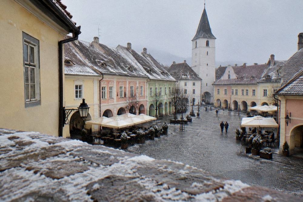 Cafes and arcaded houses on the Little Square seen from the top of the connecting passage