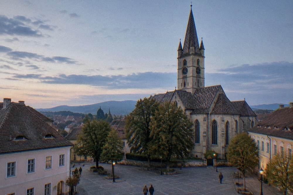 A quiet cobbled square opens beside a Gothic church.