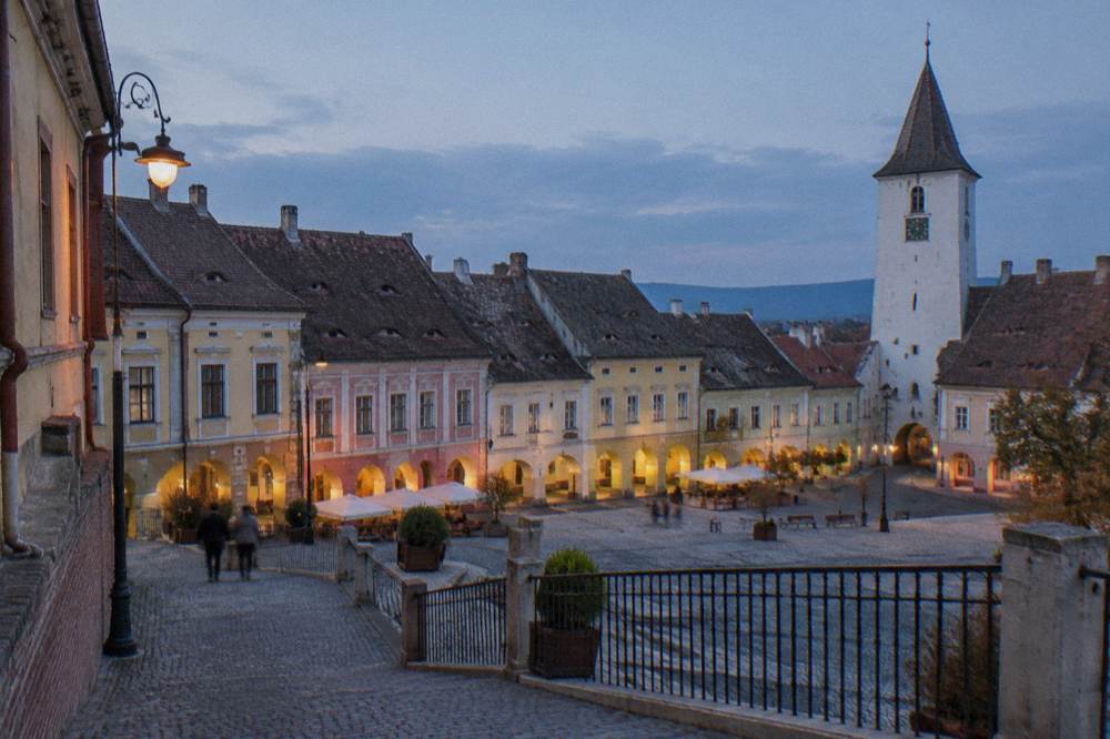 Colourful burgher houses lining the Little Square at the top of the staircase