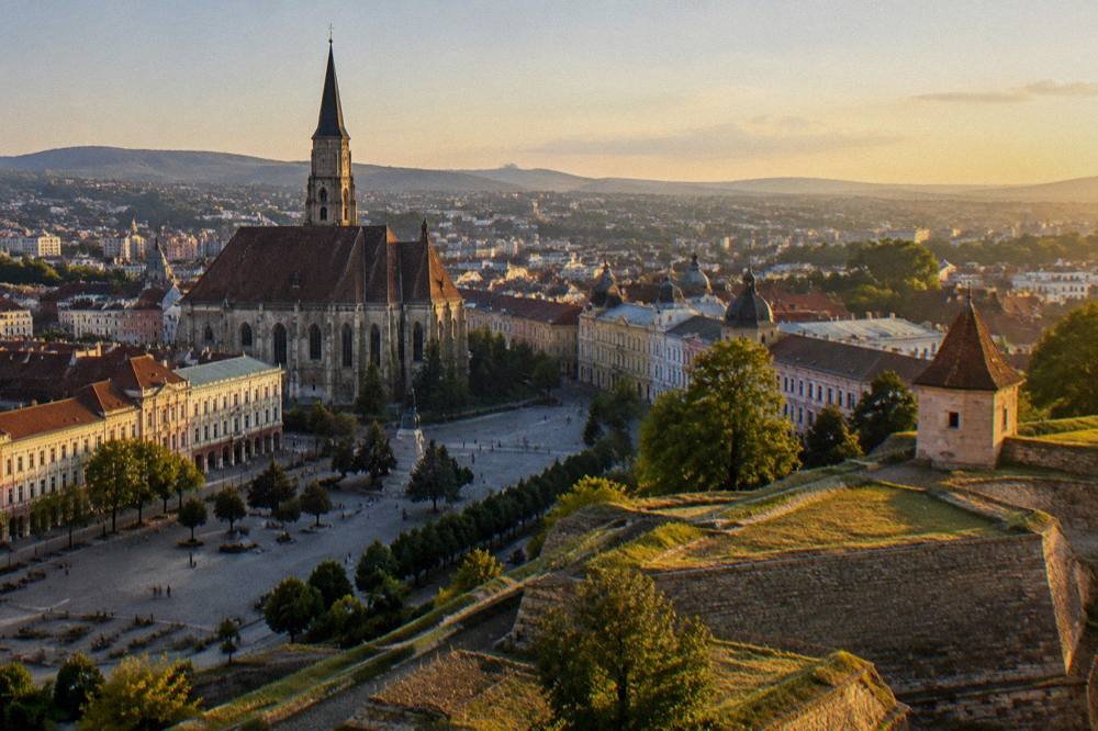 Golden evening light over a historic fortress wall with star-shaped ramparts