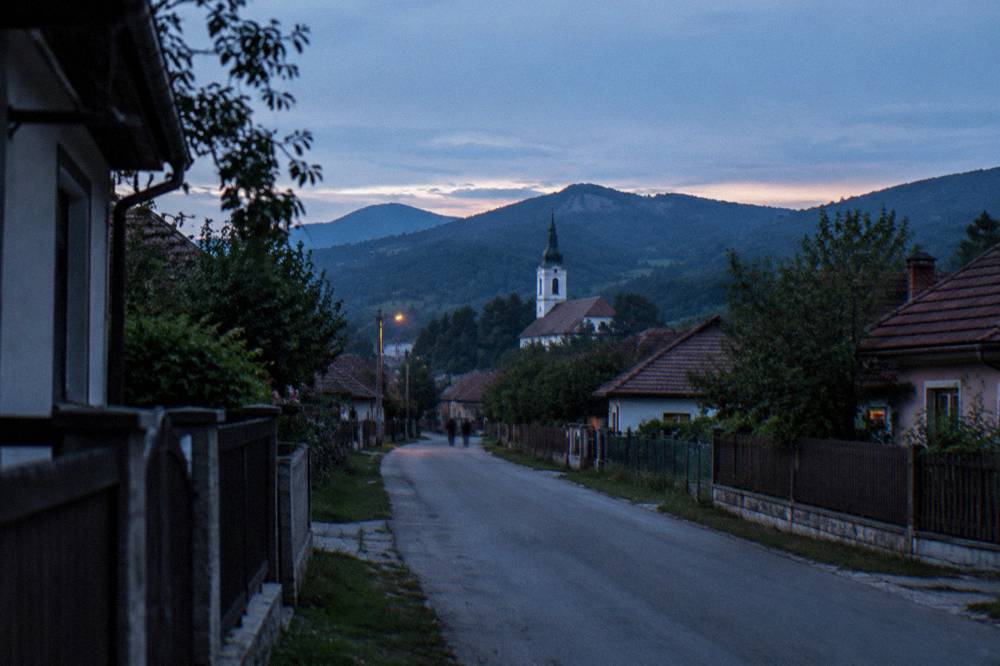 Village street in Rășinari with traditional houses and fenced yards