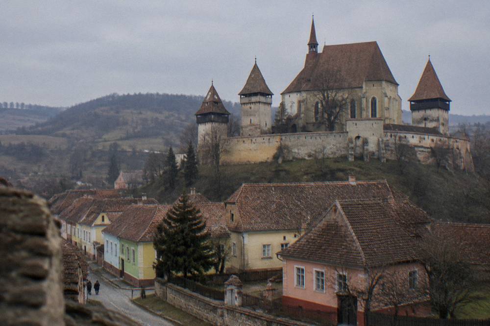 A fortified church with high defensive walls in a Transylvanian village