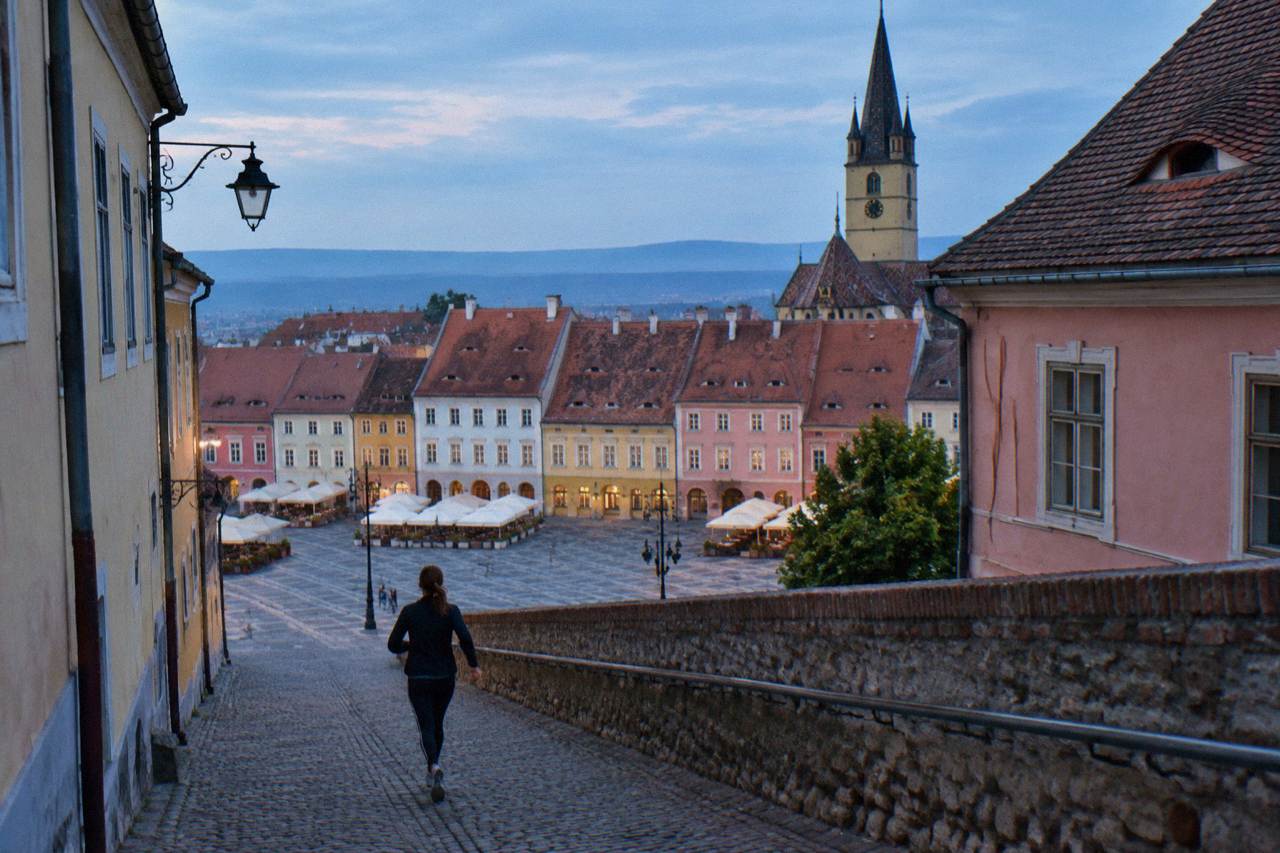 The coloured facades of the grand square in Sibiu seen from the upper town on a bright day