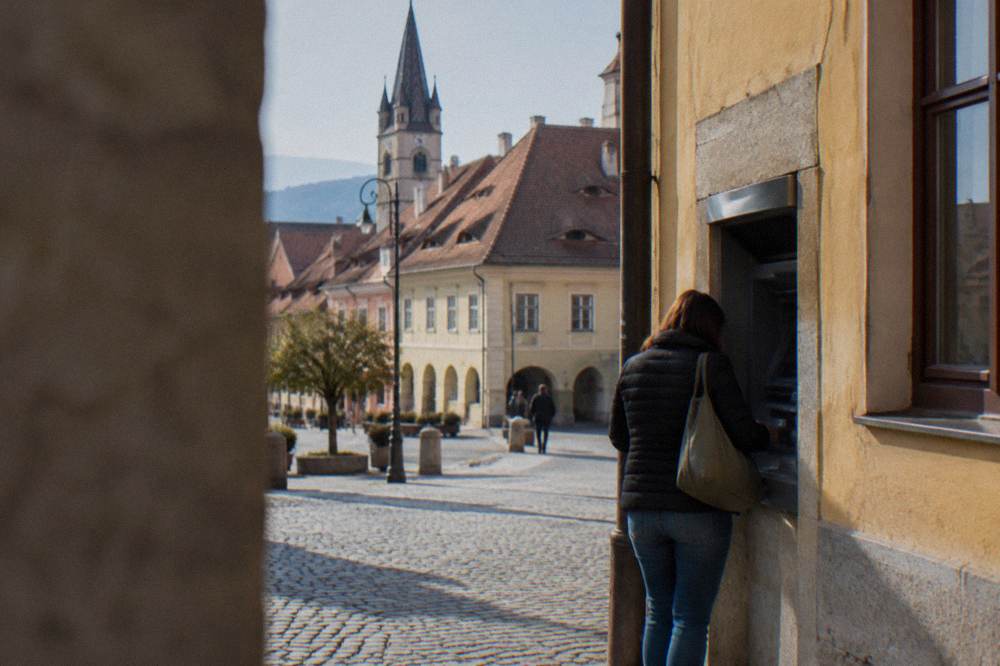 Bank ATM set into a wall on a European old town street