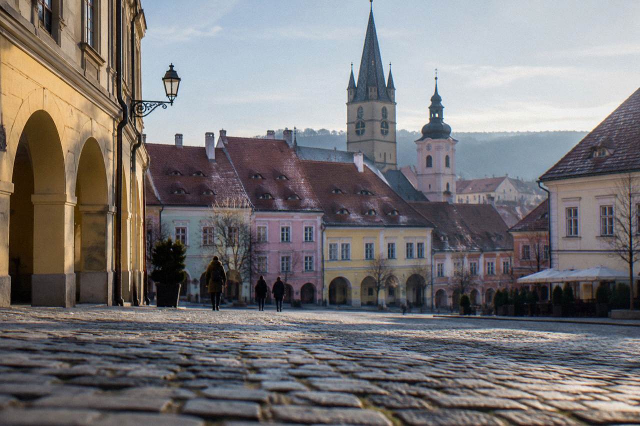 Colourful baroque houses and church spires above the rooftops of Sibiu old town