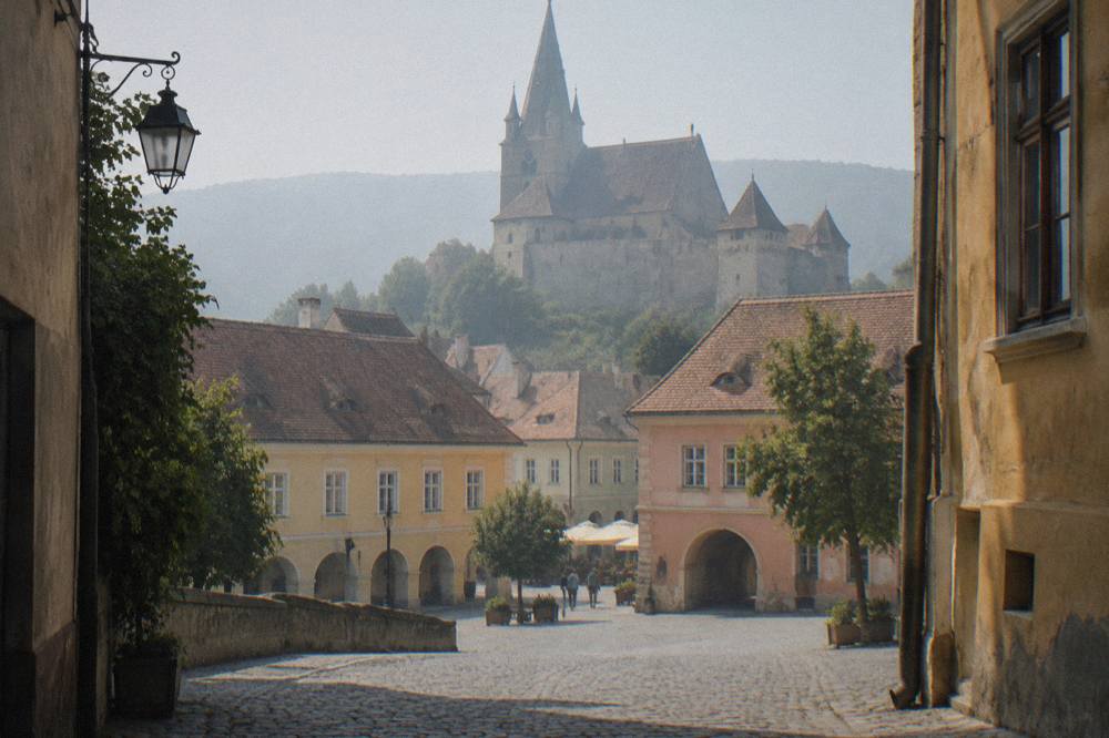 A fortified Saxon church with tall defensive walls in a Transylvanian village