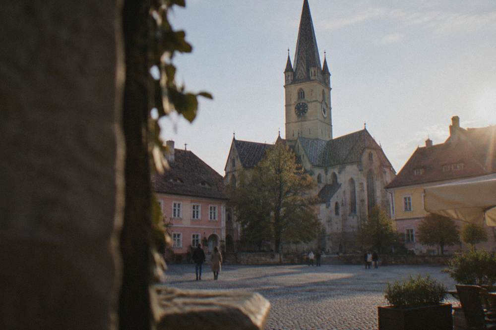 A medieval square ringed by colourful burgher houses with steep eyeglass attic windows