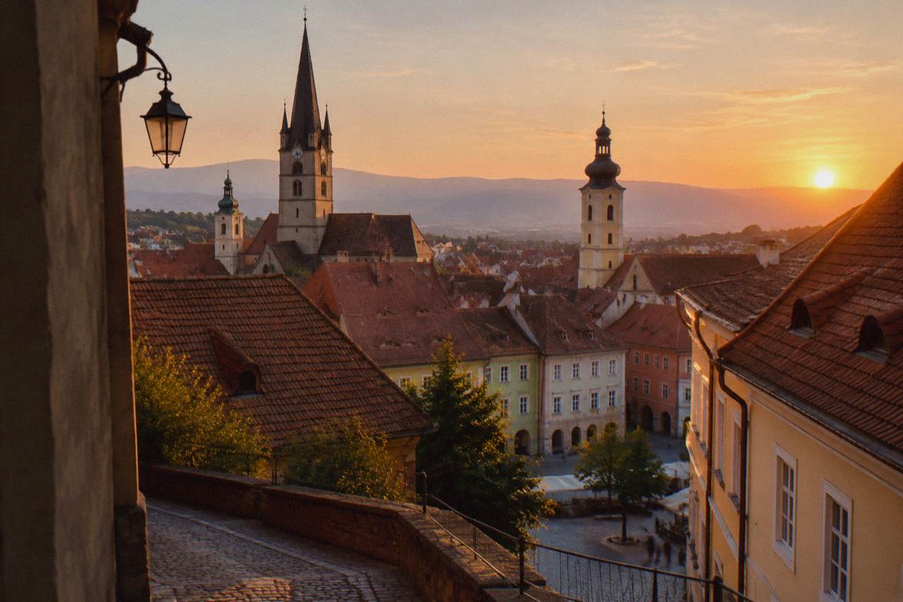 Evening view over the coloured rooftops and church towers of Sibiu old town