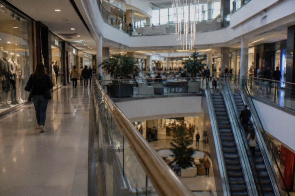 Modern shopping centre interior with shops on multiple levels