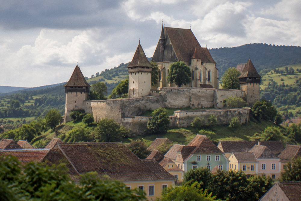 A fortified church with high defensive walls in a Transylvanian village