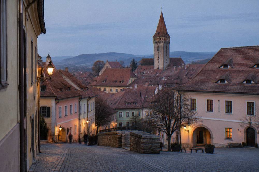 The Clock Tower rising above the red rooftops of Sighișoara's fortified old town