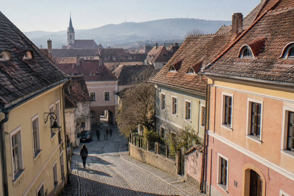 A quiet side street with old houses in a neighbourhood near Sibiu station