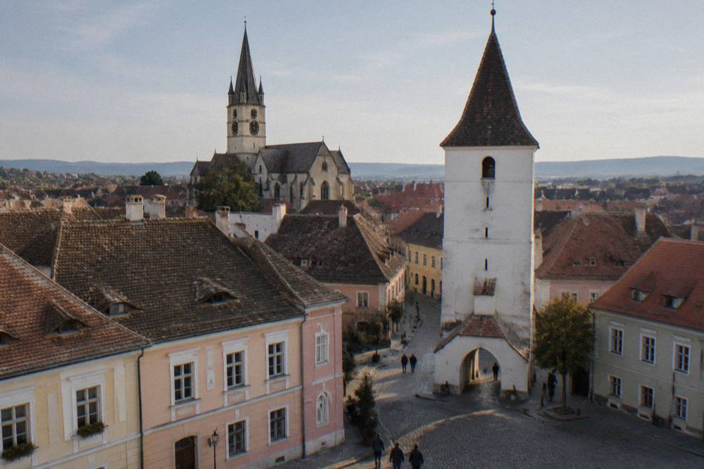 The Evangelical Cathedral and Council Tower rising above Sibiu rooftops on a clear afternoon