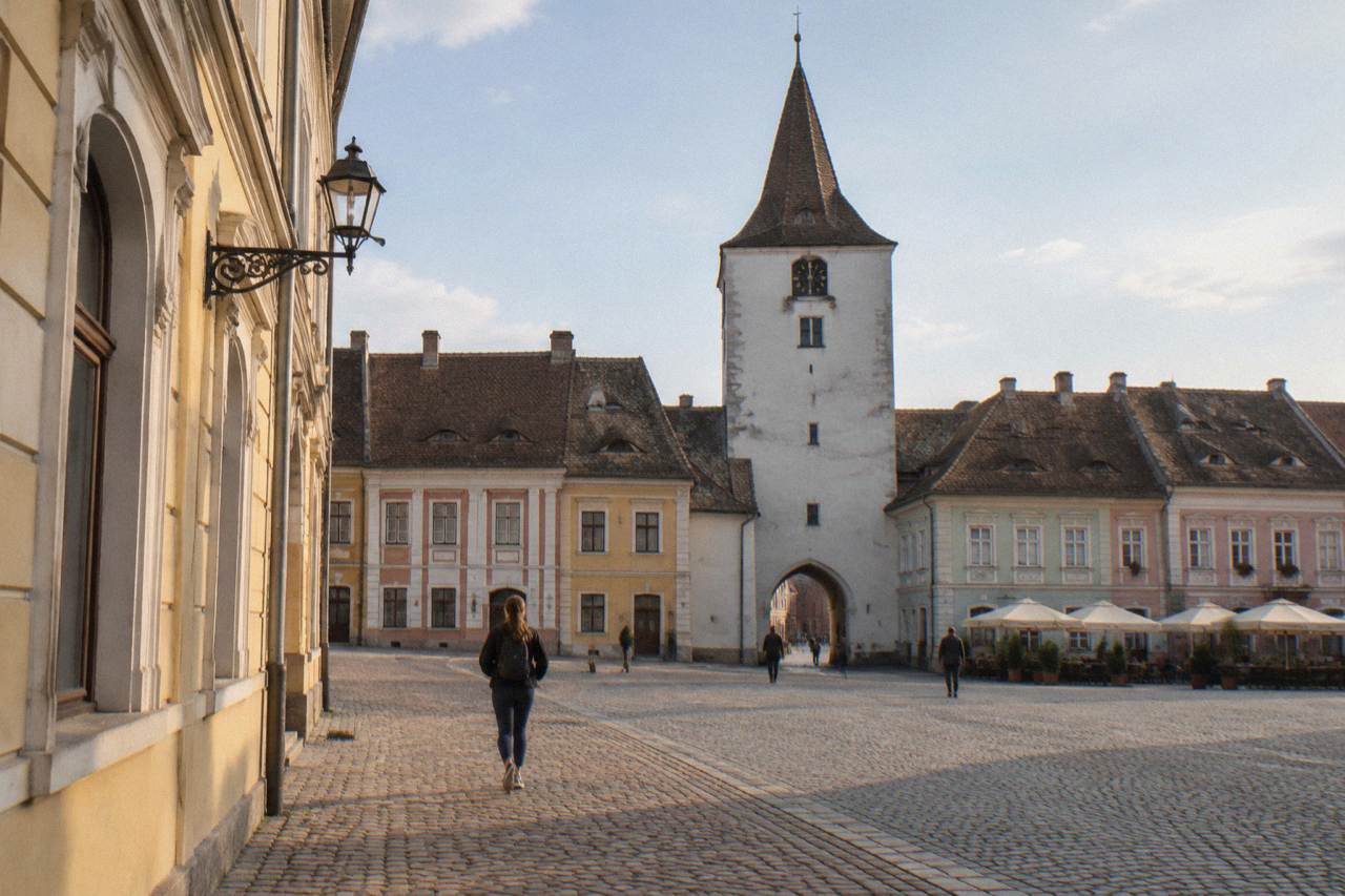 Colourful baroque houses and the Council Tower seen across the Great Square of Sibiu