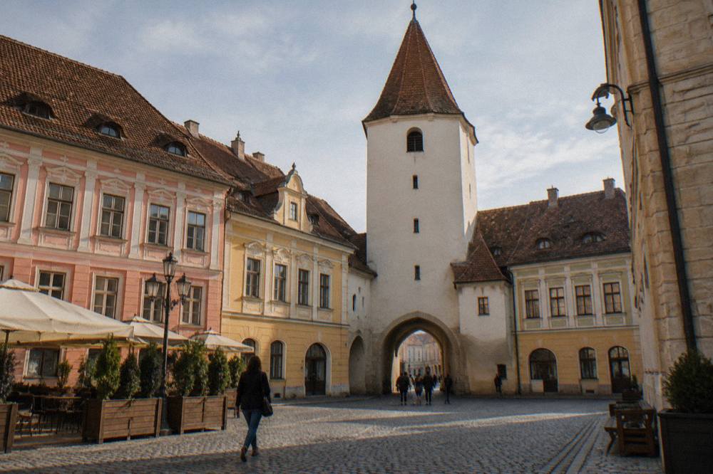 Colourful baroque buildings and the Council Tower on the grand square of Sibiu