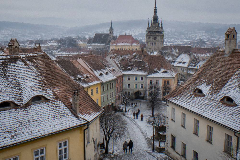 Aerial view over the red roofs of Sighișoara's walled old town