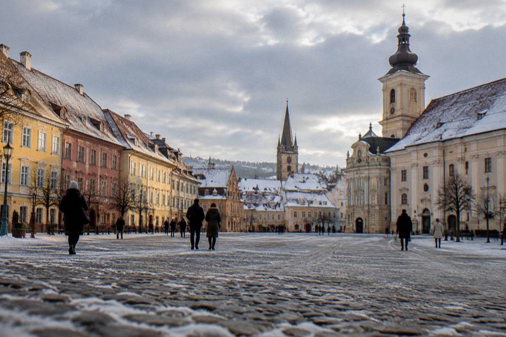 View over Sibiu's rooftops with snow and church spires
