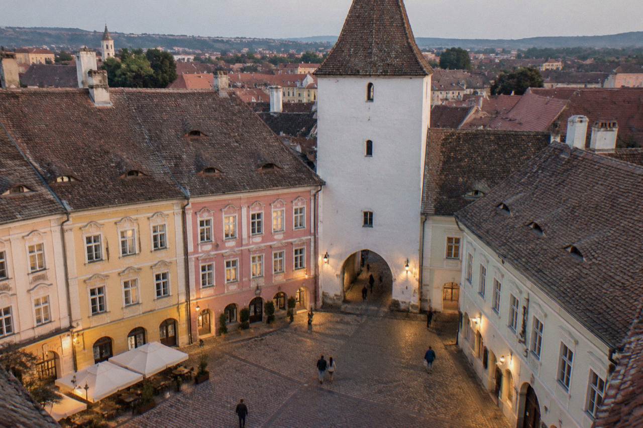 Colourful baroque buildings and the Council Tower rising above the grand square of Sibiu