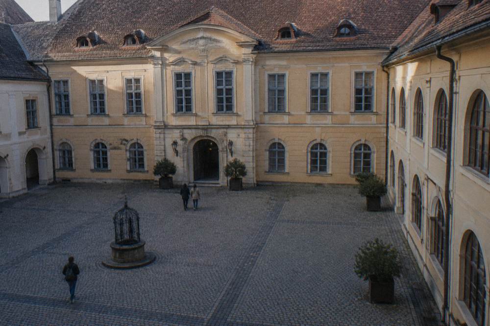 Interior courtyard of the Brukenthal Palace in Sibiu with arched windows