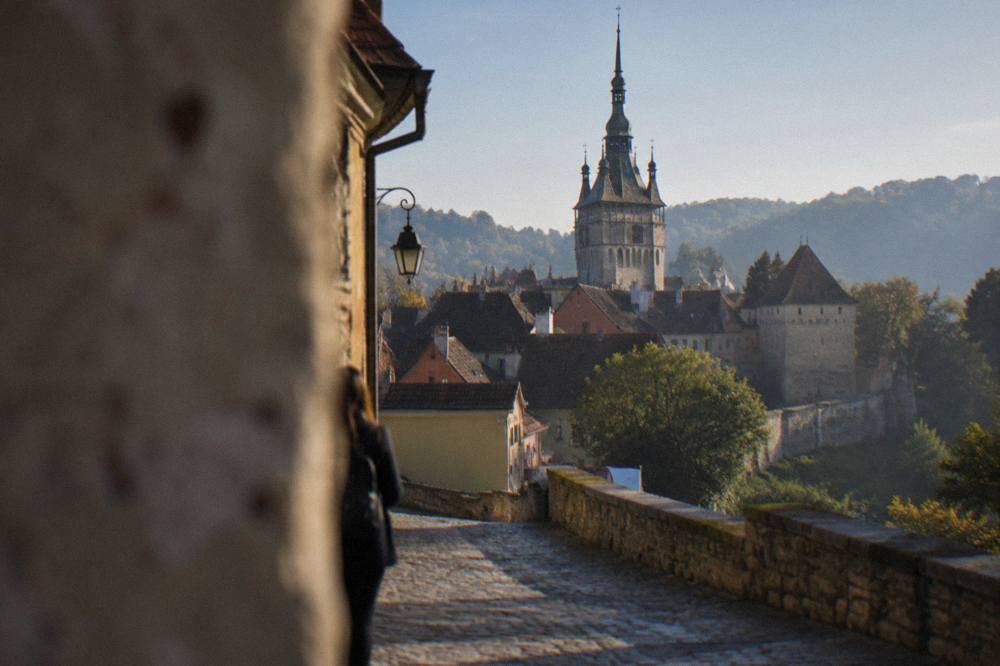 The Clock Tower rising above the rooftops of the Sighișoara citadel